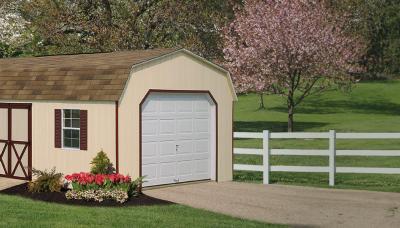 single car garage with tan t1-11 siding and single garage door