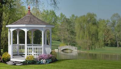 White vinyl gazebo by pond