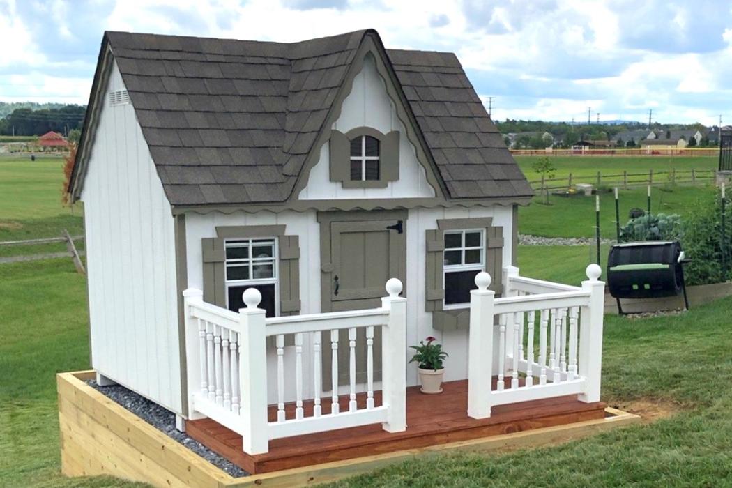 side view of small playhouse with min deck.