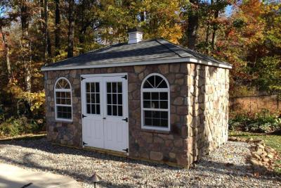 Hip Roof min barn with stone siding