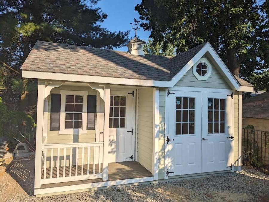 Tan shed with front porch